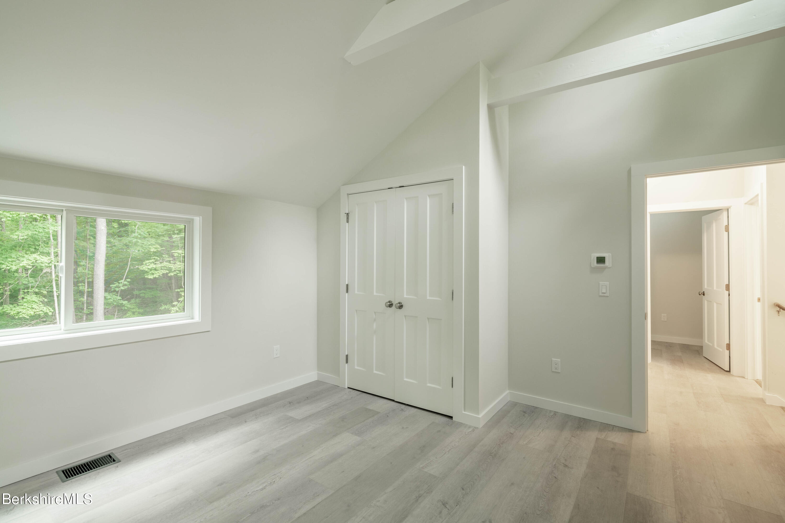 220 Hupi Road Monterey, MA 01245 - Photo 32 of 38 a view of an empty room with wooden floor and a window