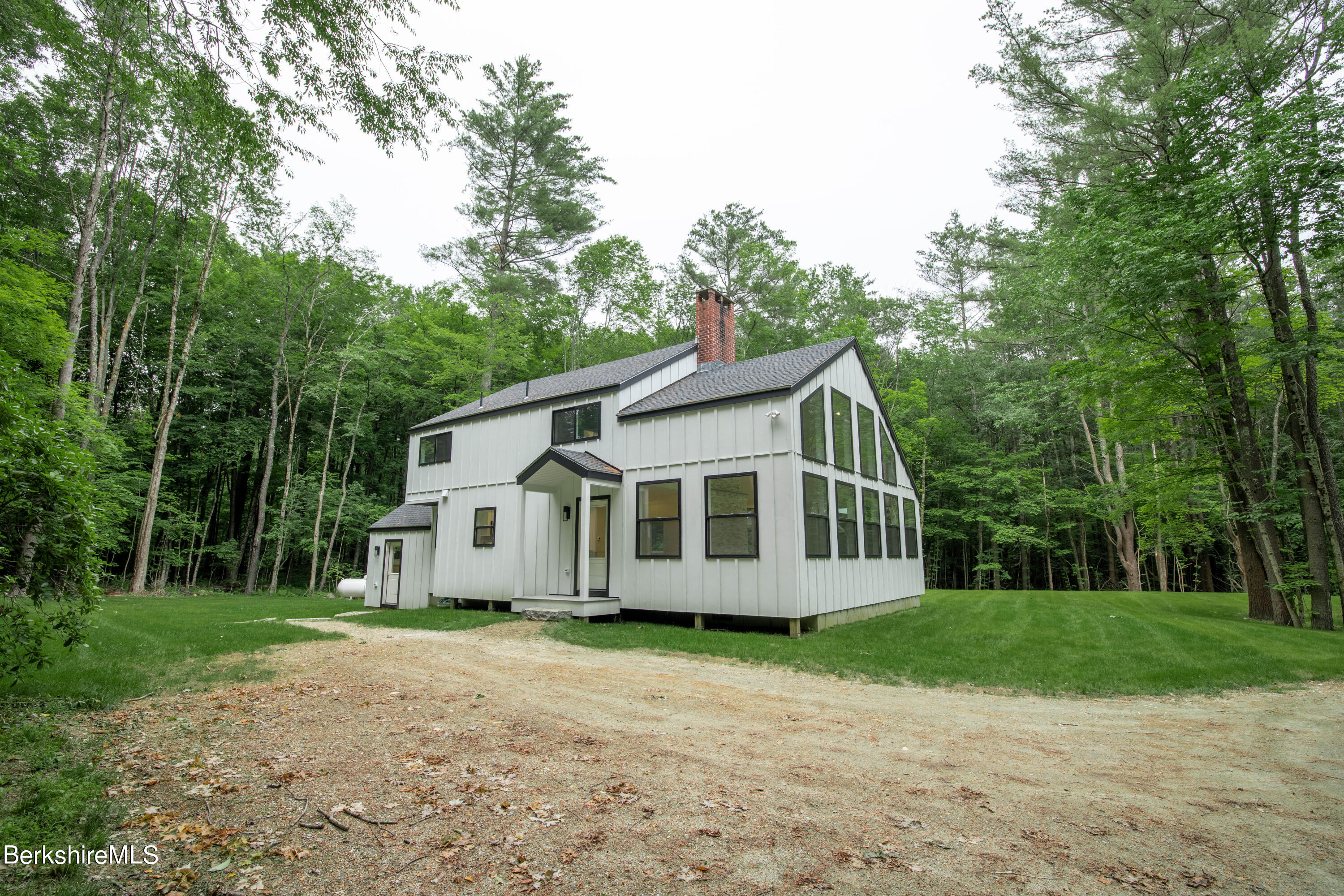 220 Hupi Road Monterey, MA 01245 - Photo 4 of 38 a view of a house with a yard
