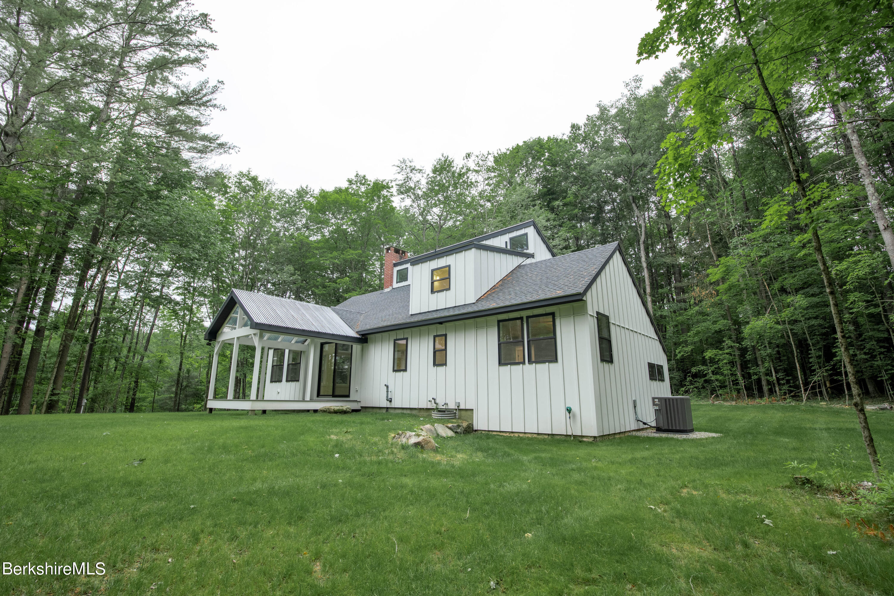 220 Hupi Road Monterey, MA 01245 - Photo 7 of 38 a view of a house with backyard and garden