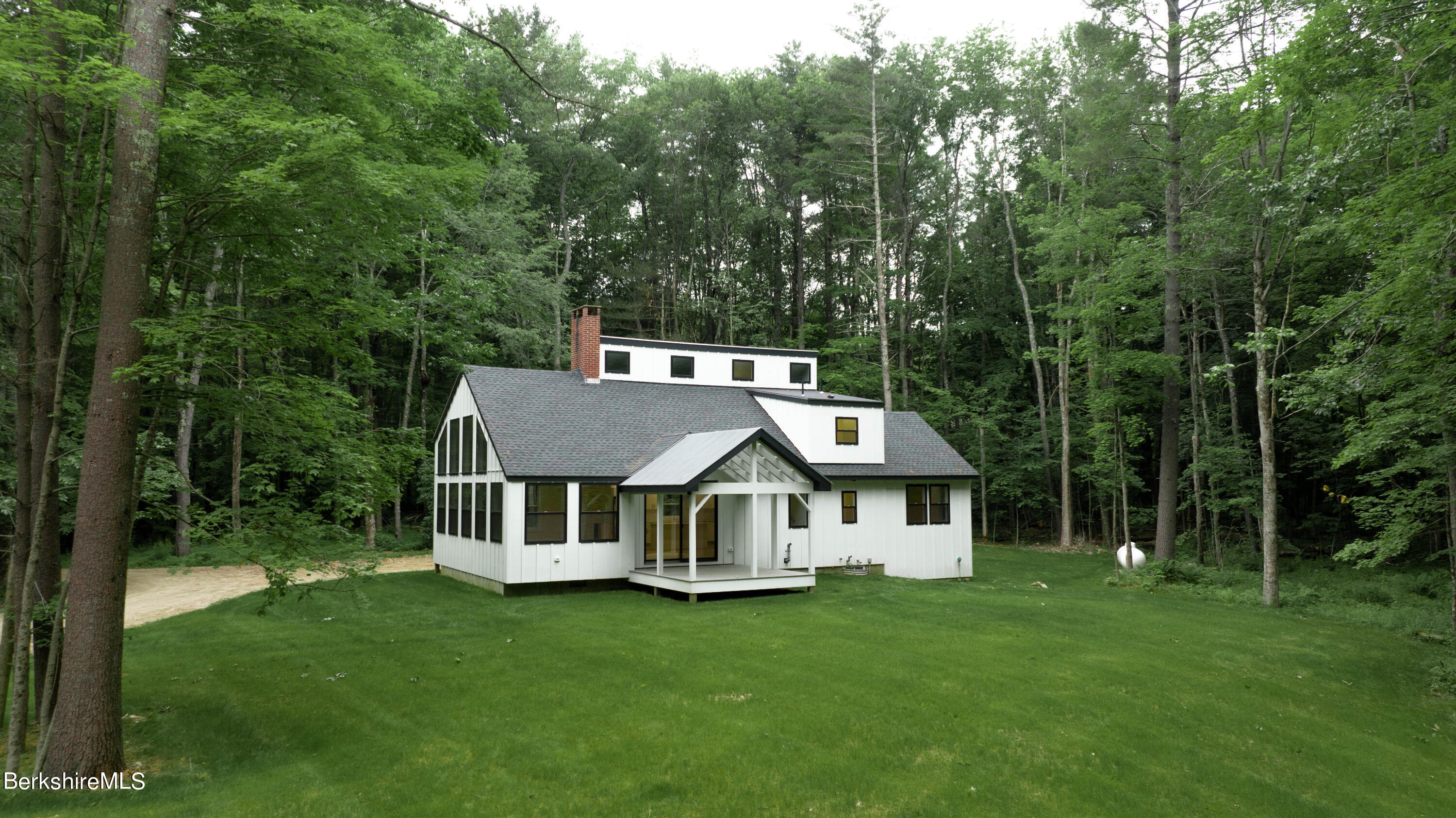 220 Hupi Road Monterey, MA 01245 - Photo 10 of 38 a view of a house with a big yard