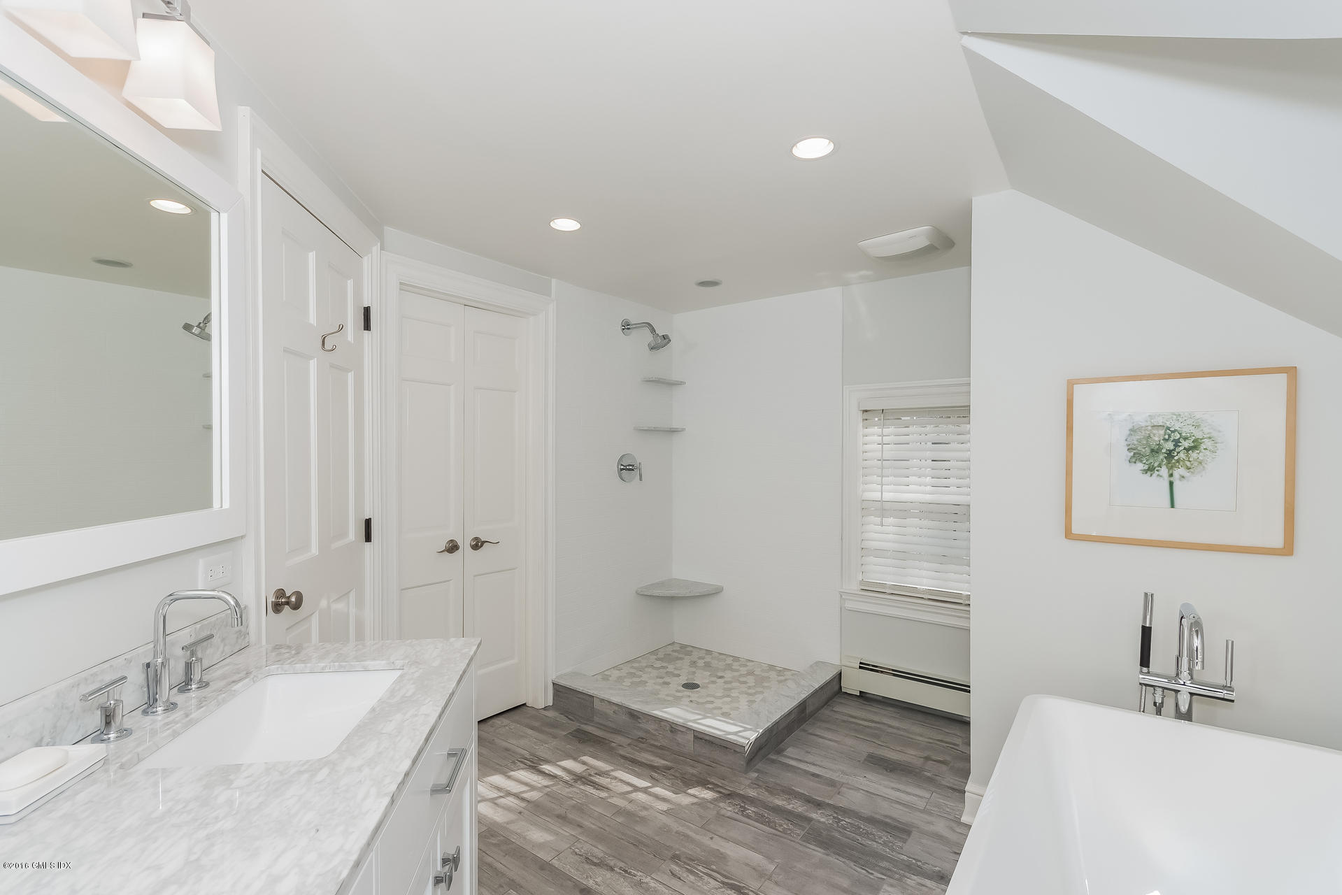 122 Hollow Tree Ridge Road Darien, CT 06820 - Photo 33 of 49 a spacious bathroom with a granite countertop sink a toilet a shower and a mirror
