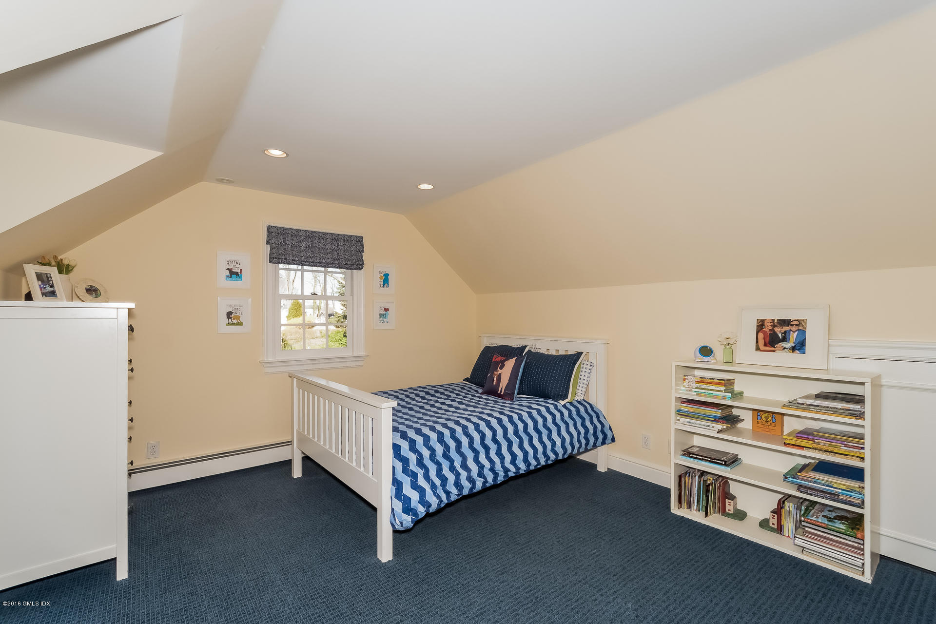 122 Hollow Tree Ridge Road Darien, CT 06820 - Photo 36 of 49 a bedroom with a bed and a window