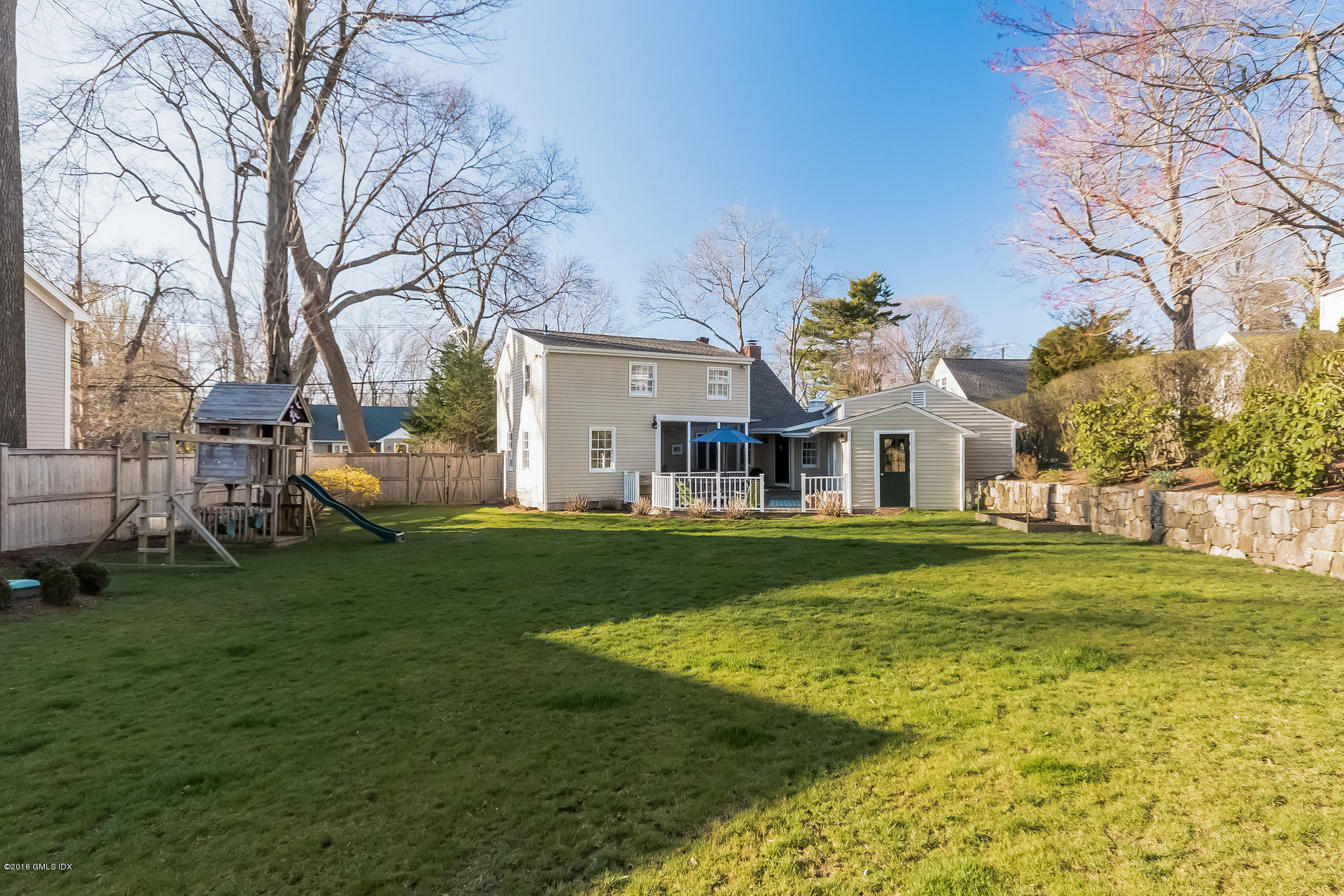 122 Hollow Tree Ridge Road Darien, CT 06820 - Photo 44 of 49 a view of a house with a yard