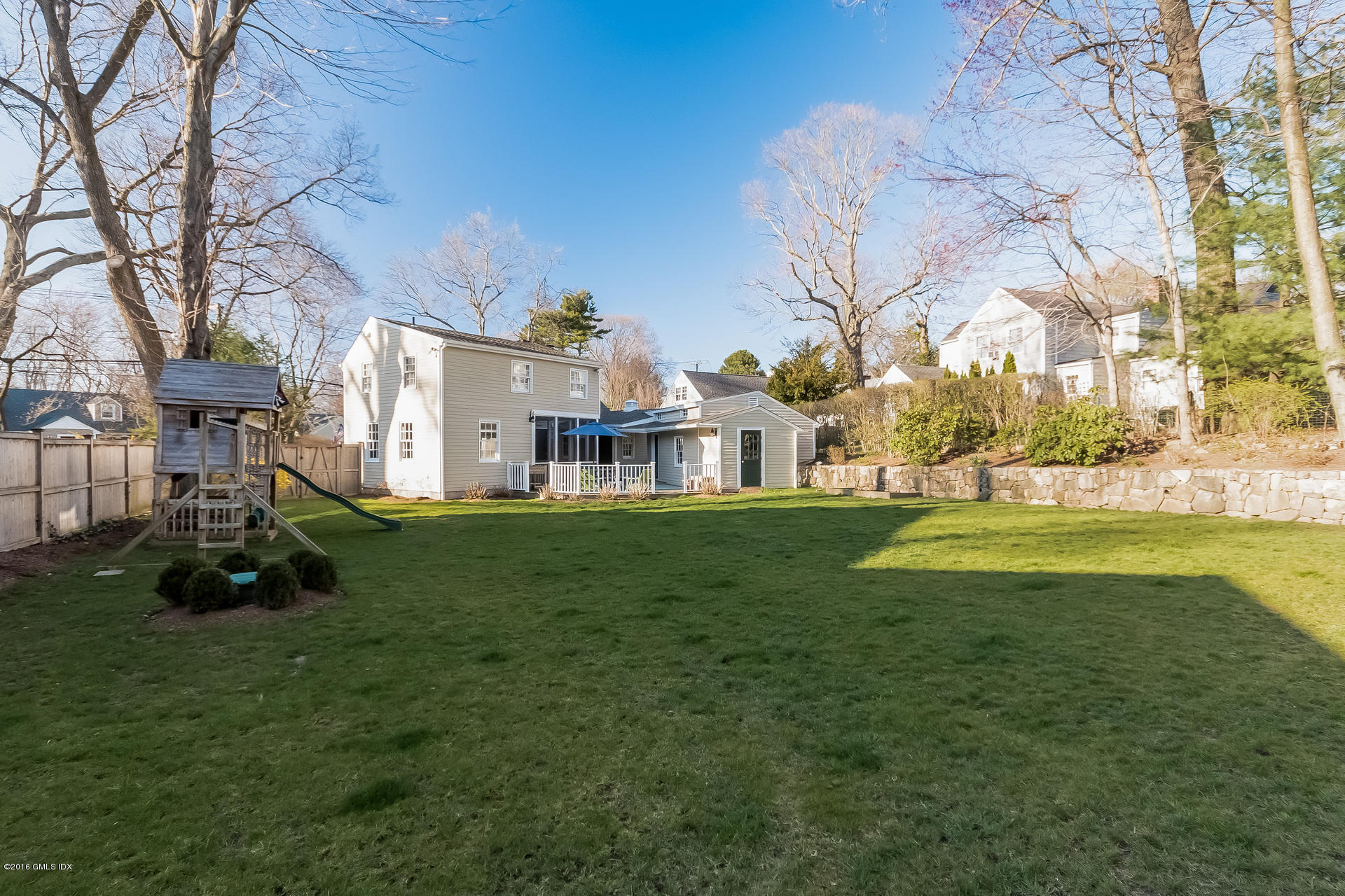 122 Hollow Tree Ridge Road Darien, CT 06820 - Photo 45 of 49 a view of a house with a big yard