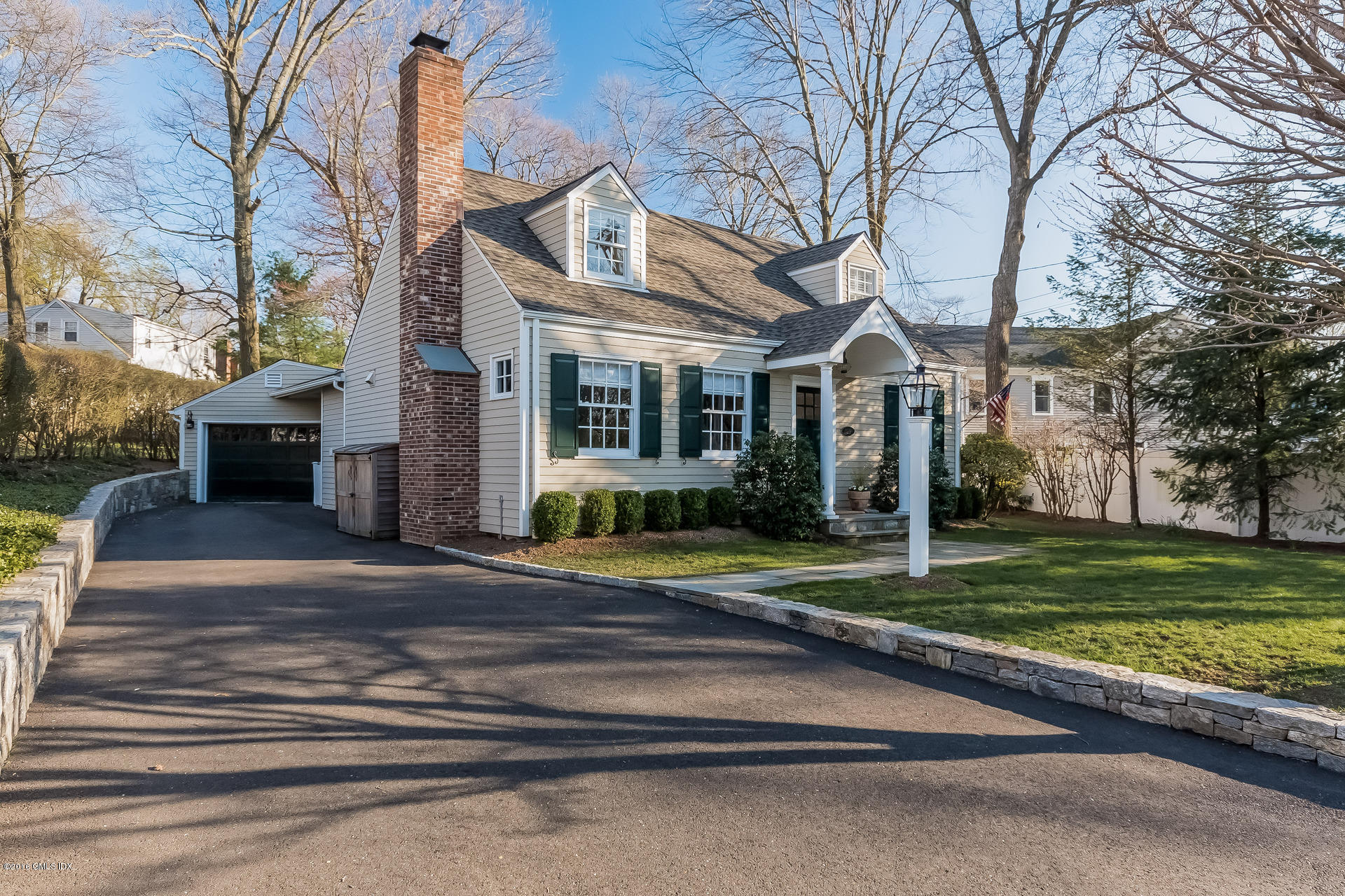 122 Hollow Tree Ridge Road Darien, CT 06820 - Photo 7 of 49 a front view of a house with a yard