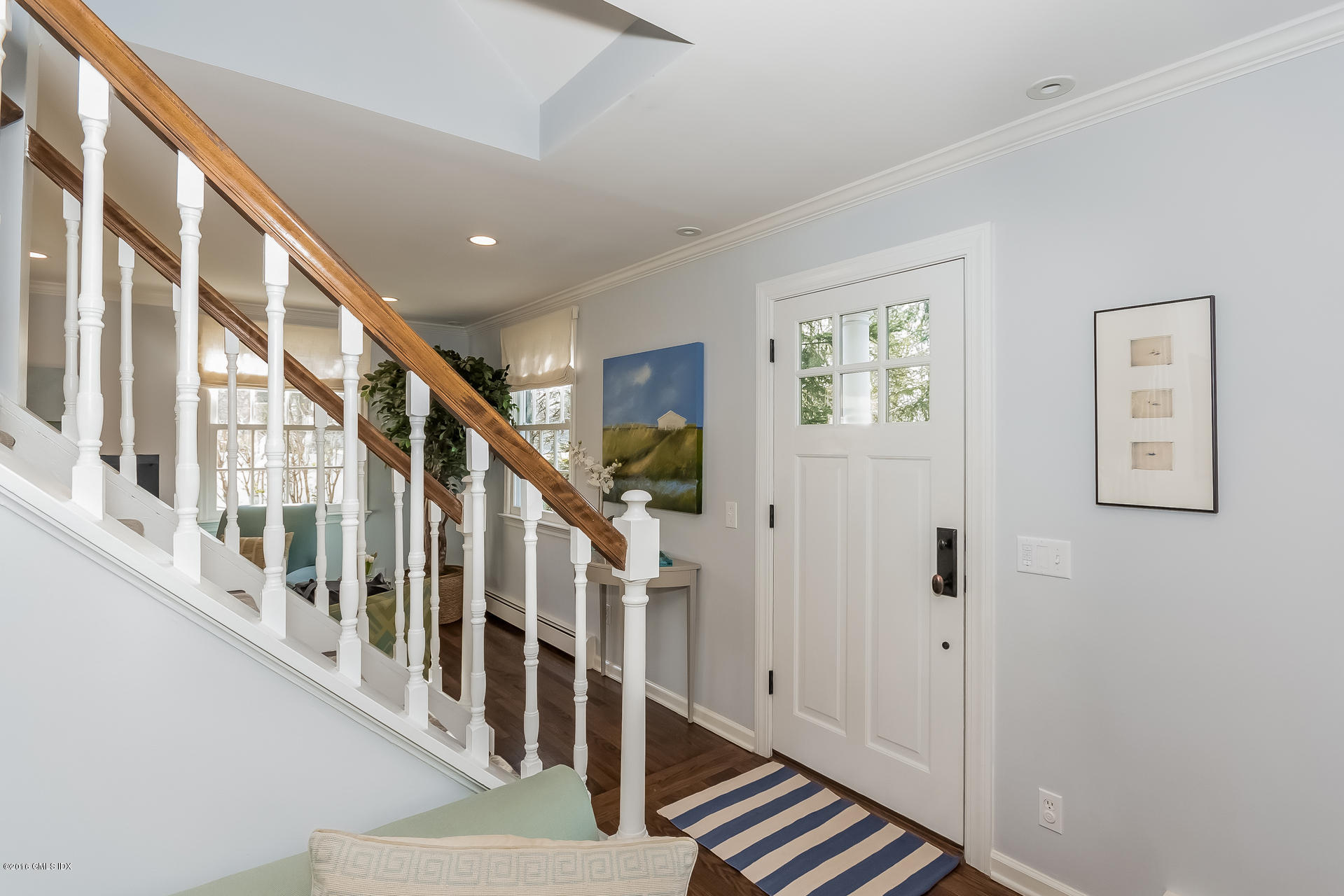 122 Hollow Tree Ridge Road Darien, CT 06820 - Photo 8 of 49 a view of an entryway with staircase