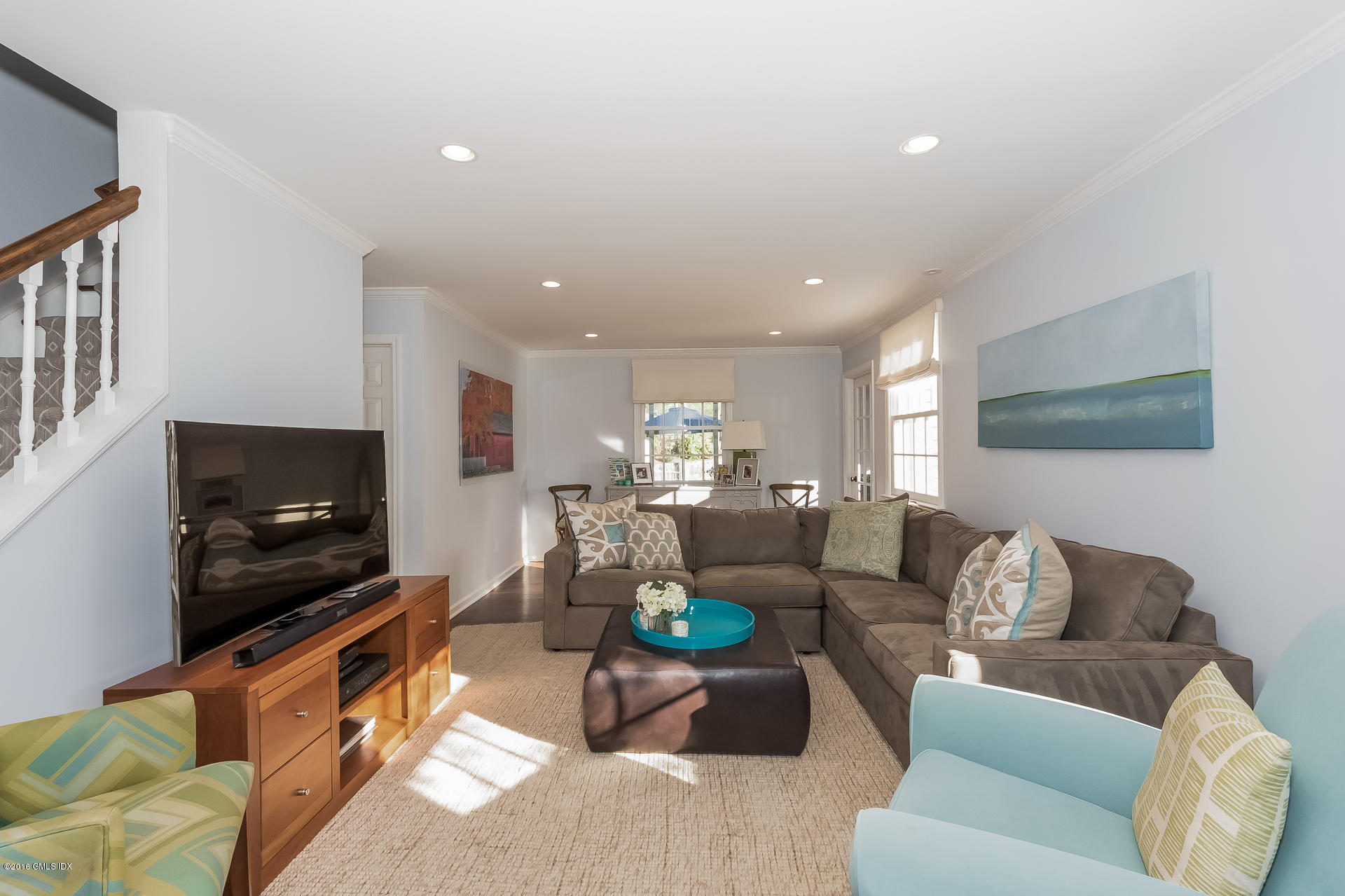 122 Hollow Tree Ridge Road Darien, CT 06820 - Photo 9 of 49 a living room with furniture and a flat screen tv