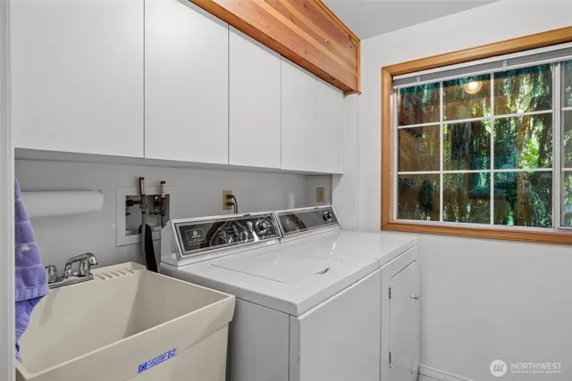 a bedroom with a large bed and a couch