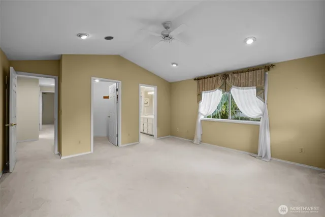 a bathroom with a tub a double vanity sink and mirror