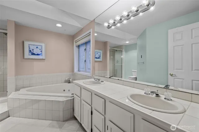 a bathroom with a bathtub and shower