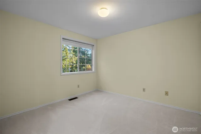 a view of a chairs and table in patio with wooden floor
