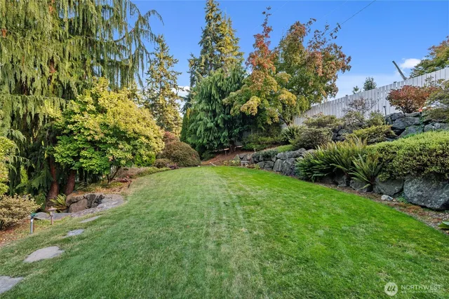 a backyard of a house with lots of green space