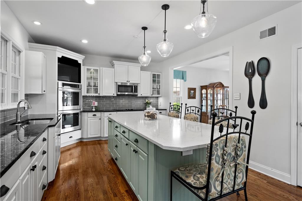3012 East Ridge Drive Gibsonia, PA 15044 - Photo 15 of 50 a large kitchen with kitchen island lots of counter space a sink appliances and cabinets