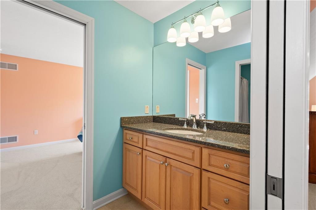 3012 East Ridge Drive Gibsonia, PA 15044 - Photo 19 of 50 a bathroom with a granite countertop sink and a mirror