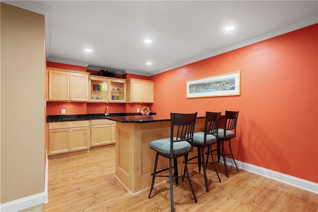 3012 East Ridge Drive Gibsonia, PA 15044 - Photo 38 of 50 a kitchen with stainless steel appliances kitchen island granite countertop a table and chairs in it