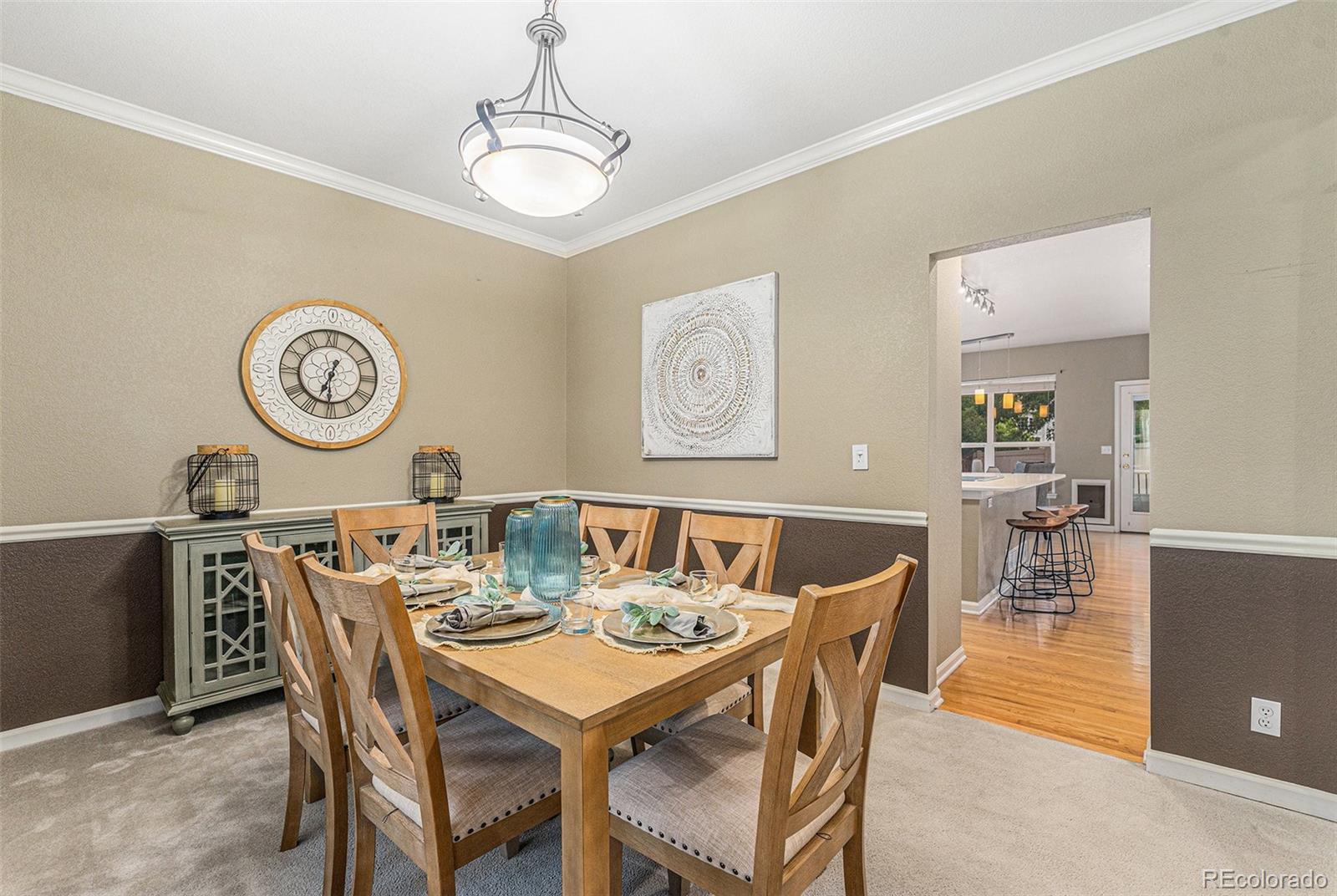 9705 Carr Circle Westminster, CO 80021 - Photo 14 of 43 a view of a dining room with furniture and a chandelier