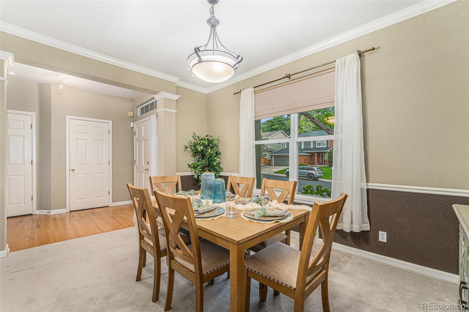 9705 Carr Circle Westminster, CO 80021 - Photo 15 of 43 a view of a dining room with furniture window and outside view