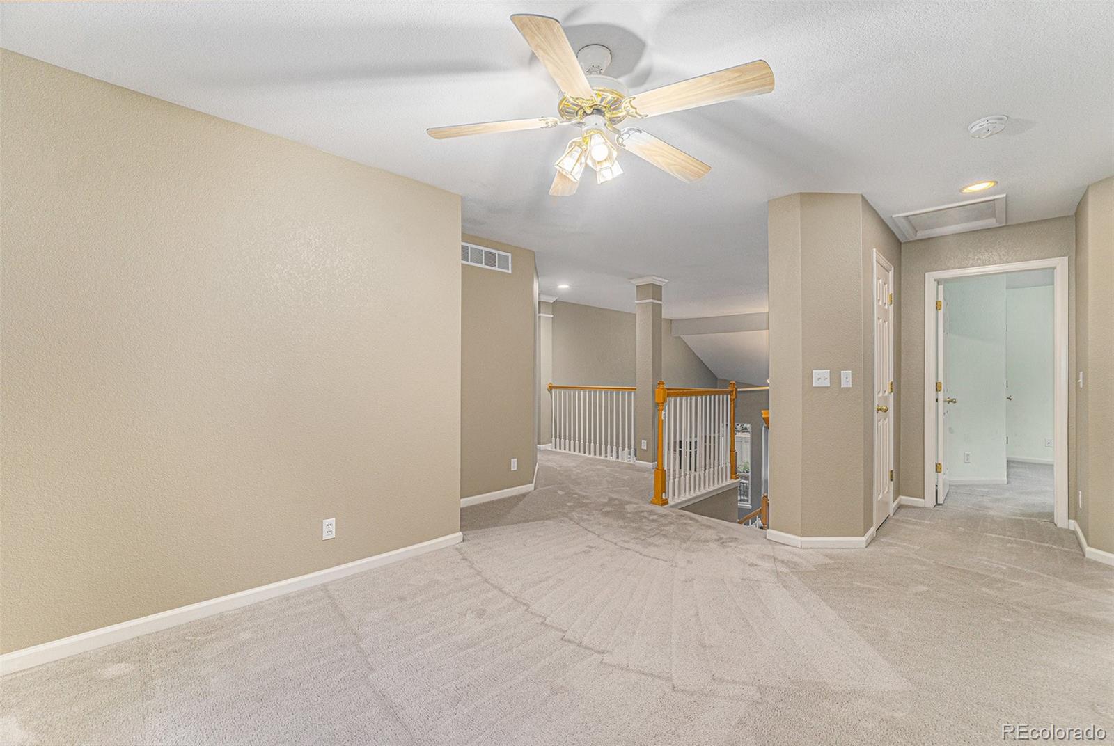 9705 Carr Circle Westminster, CO 80021 - Photo 18 of 43 an empty room with a bathroom