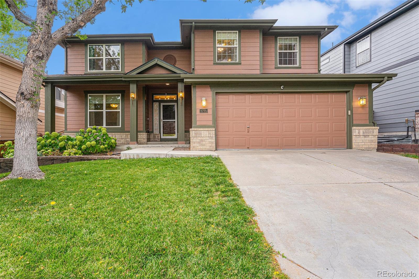 9705 Carr Circle Westminster, CO 80021 - Photo 2 of 43 front view of a house with a yard