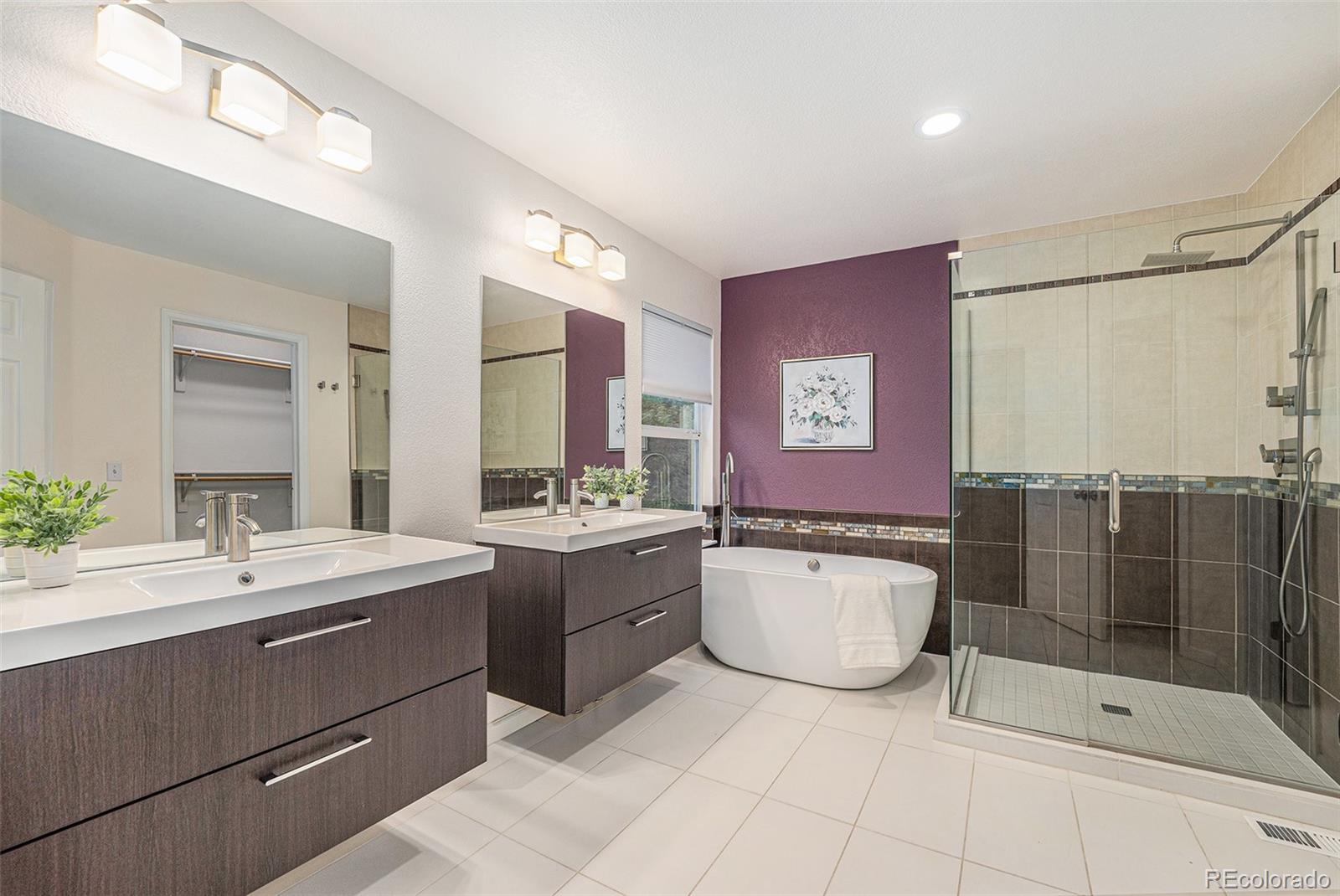 9705 Carr Circle Westminster, CO 80021 - Photo 23 of 43 a bathroom with a tub sink and mirror