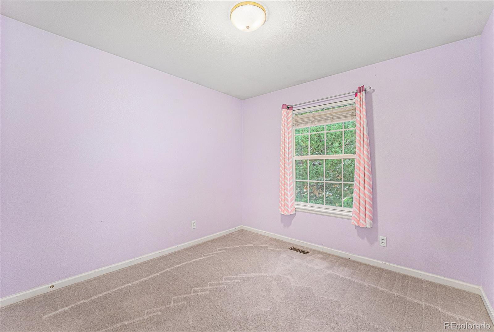 9705 Carr Circle Westminster, CO 80021 - Photo 28 of 43 an empty room with a window