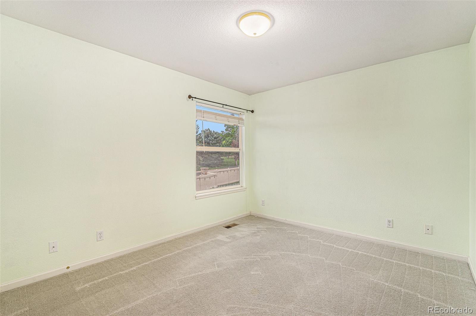 9705 Carr Circle Westminster, CO 80021 - Photo 29 of 43 an empty room with a window