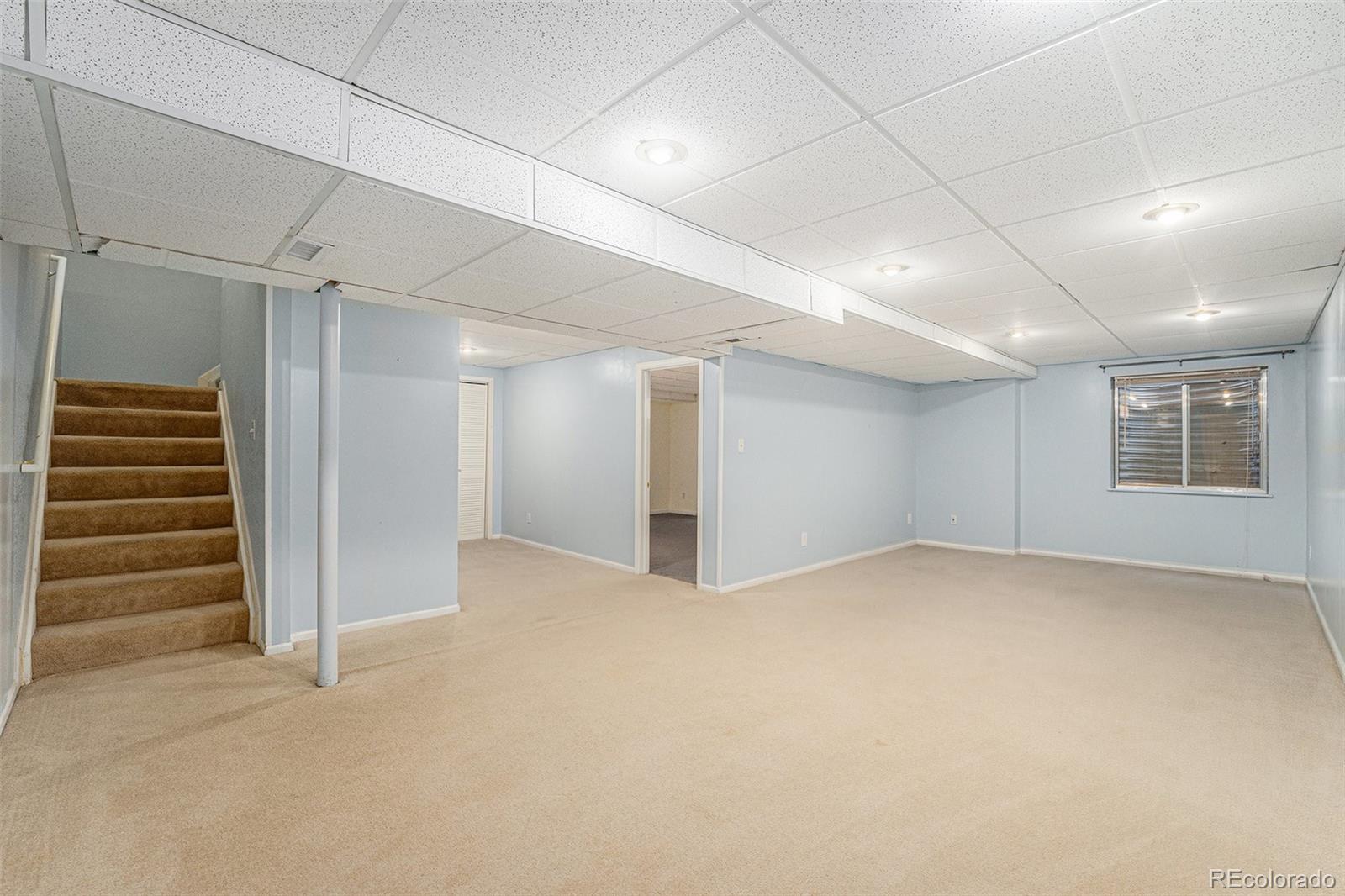 9705 Carr Circle Westminster, CO 80021 - Photo 32 of 43 a view of an empty room with a window