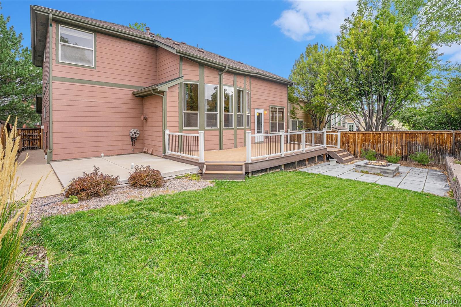 9705 Carr Circle Westminster, CO 80021 - Photo 39 of 43 a view of a house with a yard and sitting area