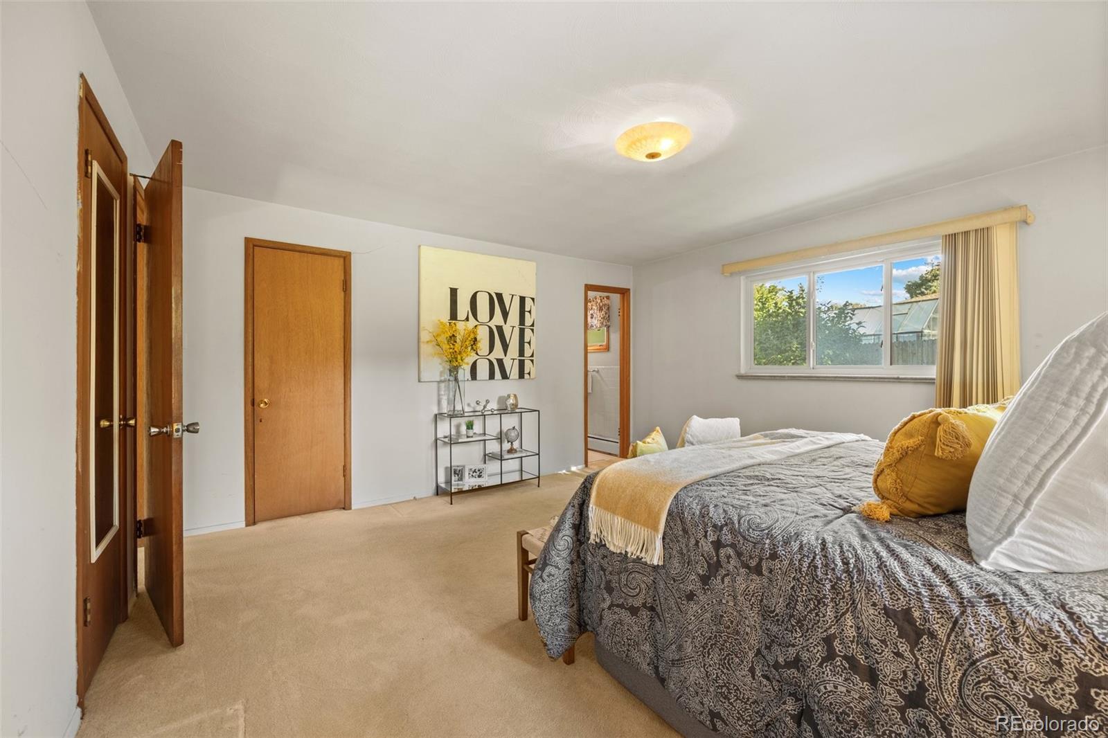 13780 Crabapple Road Golden, CO 80401 - Photo 13 of 39 a bedroom with a bed and a window