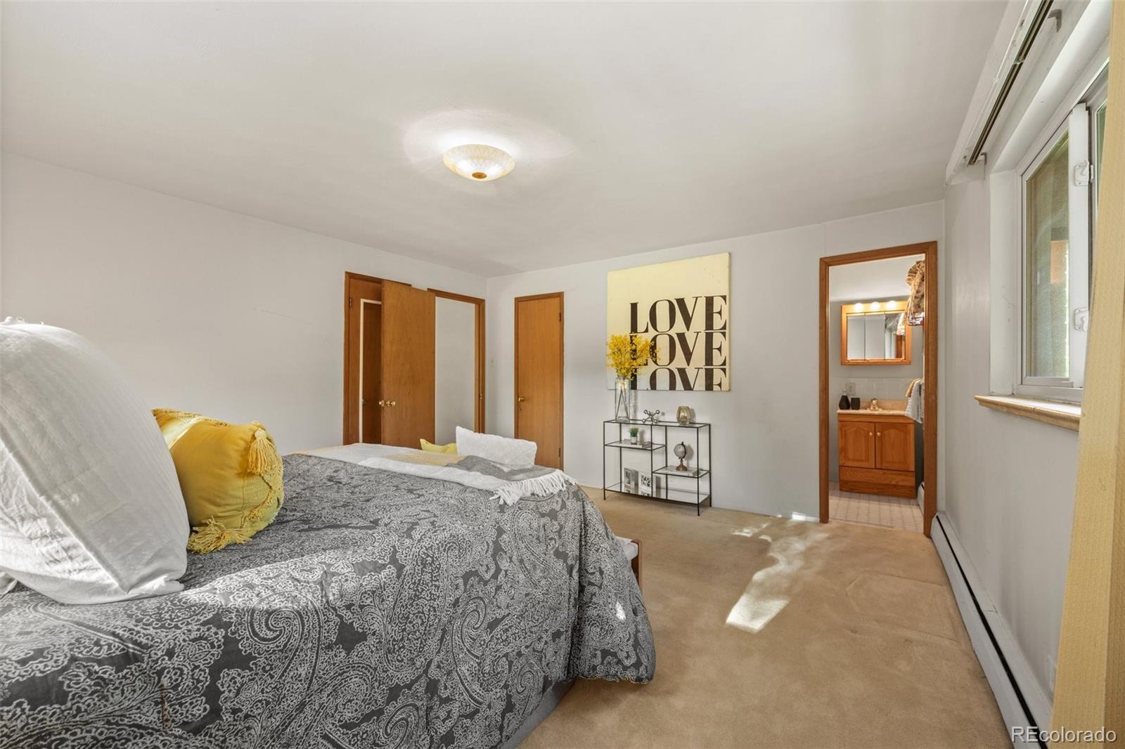 13780 Crabapple Road Golden, CO 80401 - Photo 14 of 39 a bedroom with a bed and a window