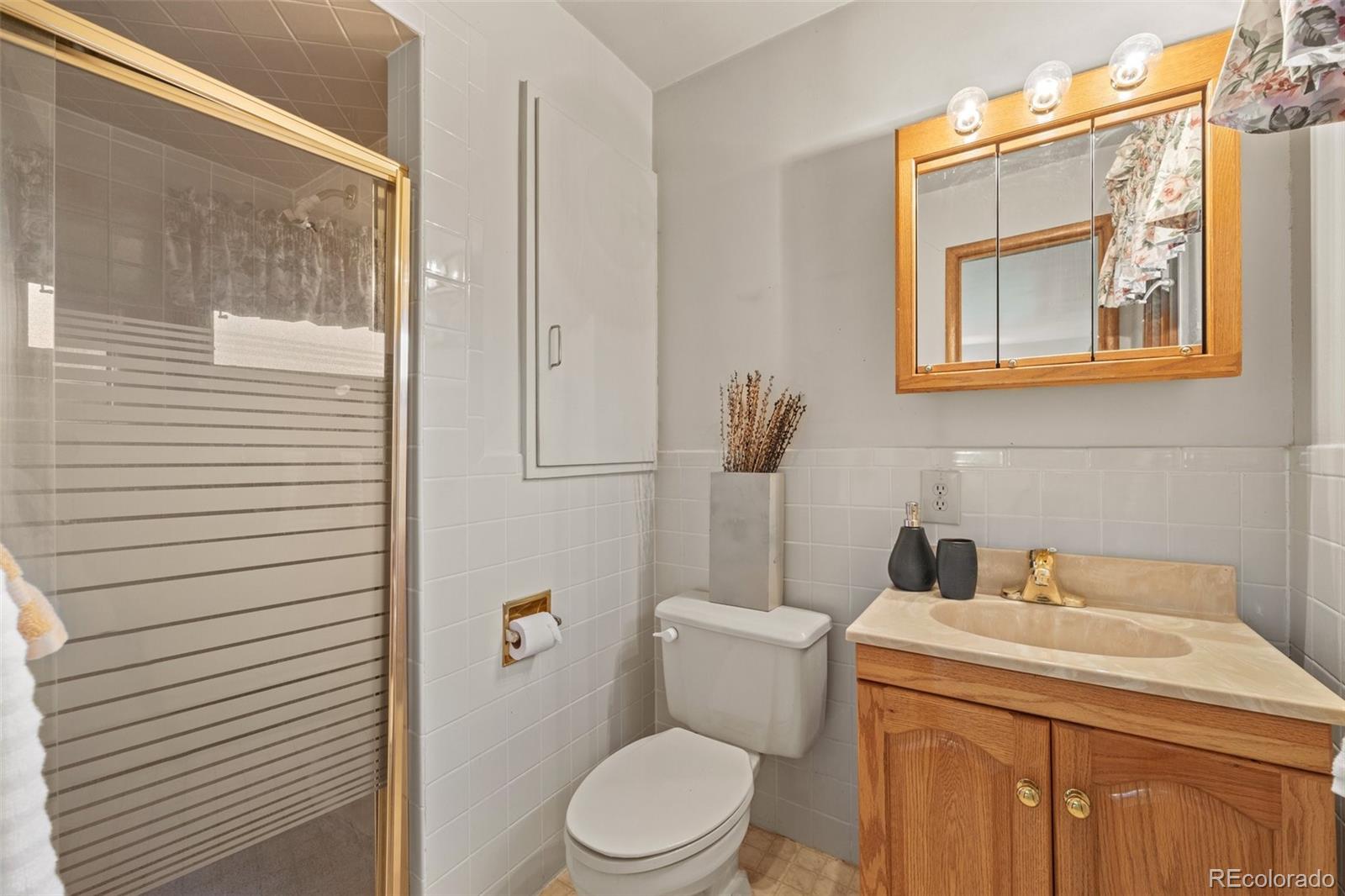 13780 Crabapple Road Golden, CO 80401 - Photo 15 of 39 a bathroom with a toilet and a sink