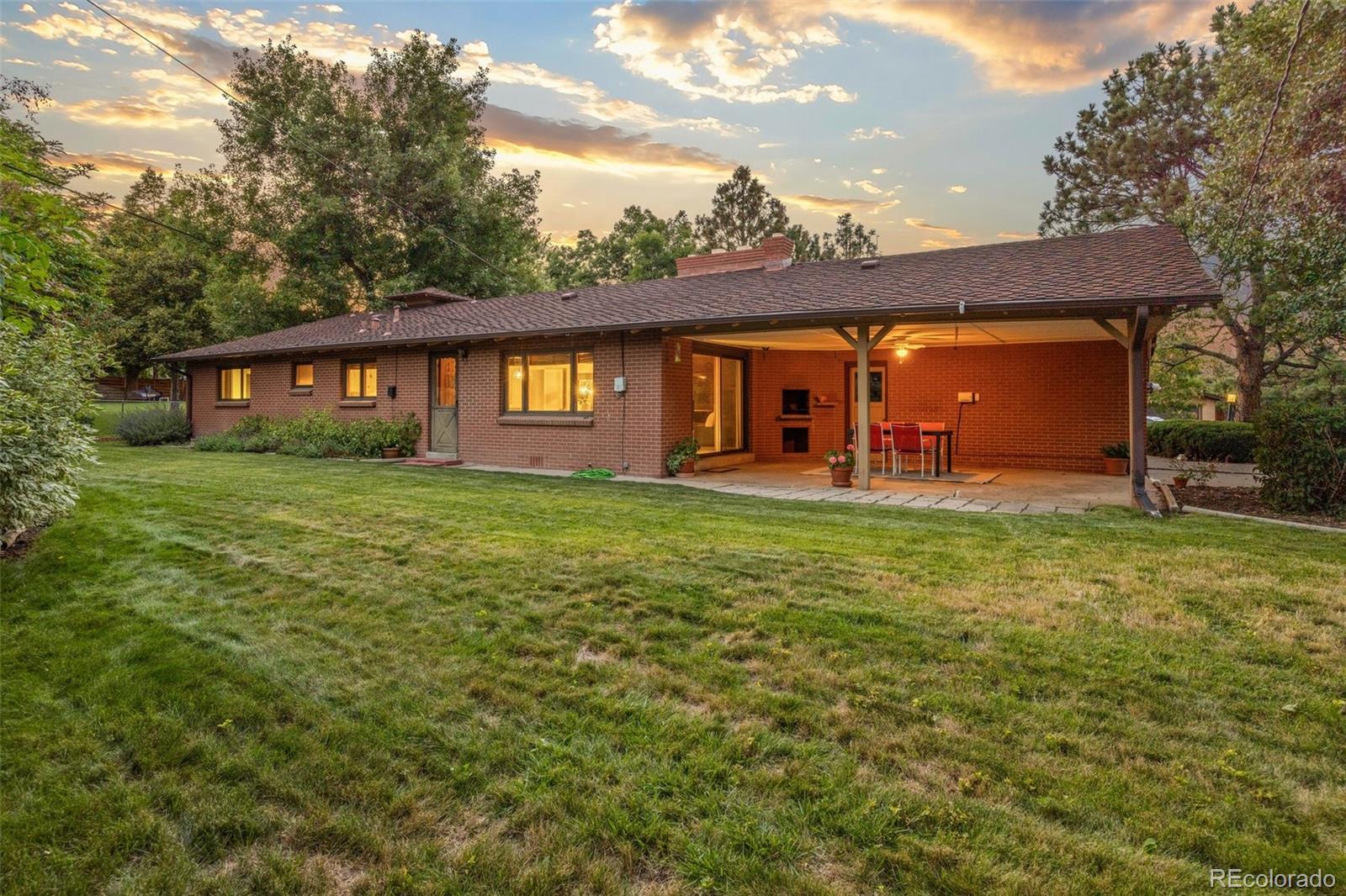 13780 Crabapple Road Golden, CO 80401 - Photo 21 of 39 front view of a house with a yard