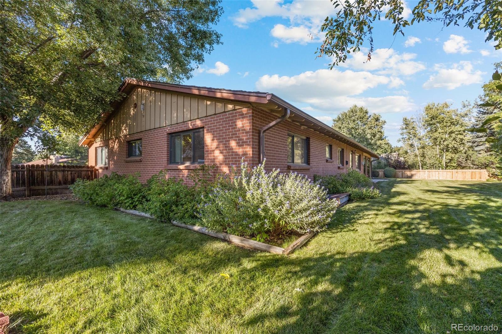 13780 Crabapple Road Golden, CO 80401 - Photo 23 of 39 a view of a house with a yard