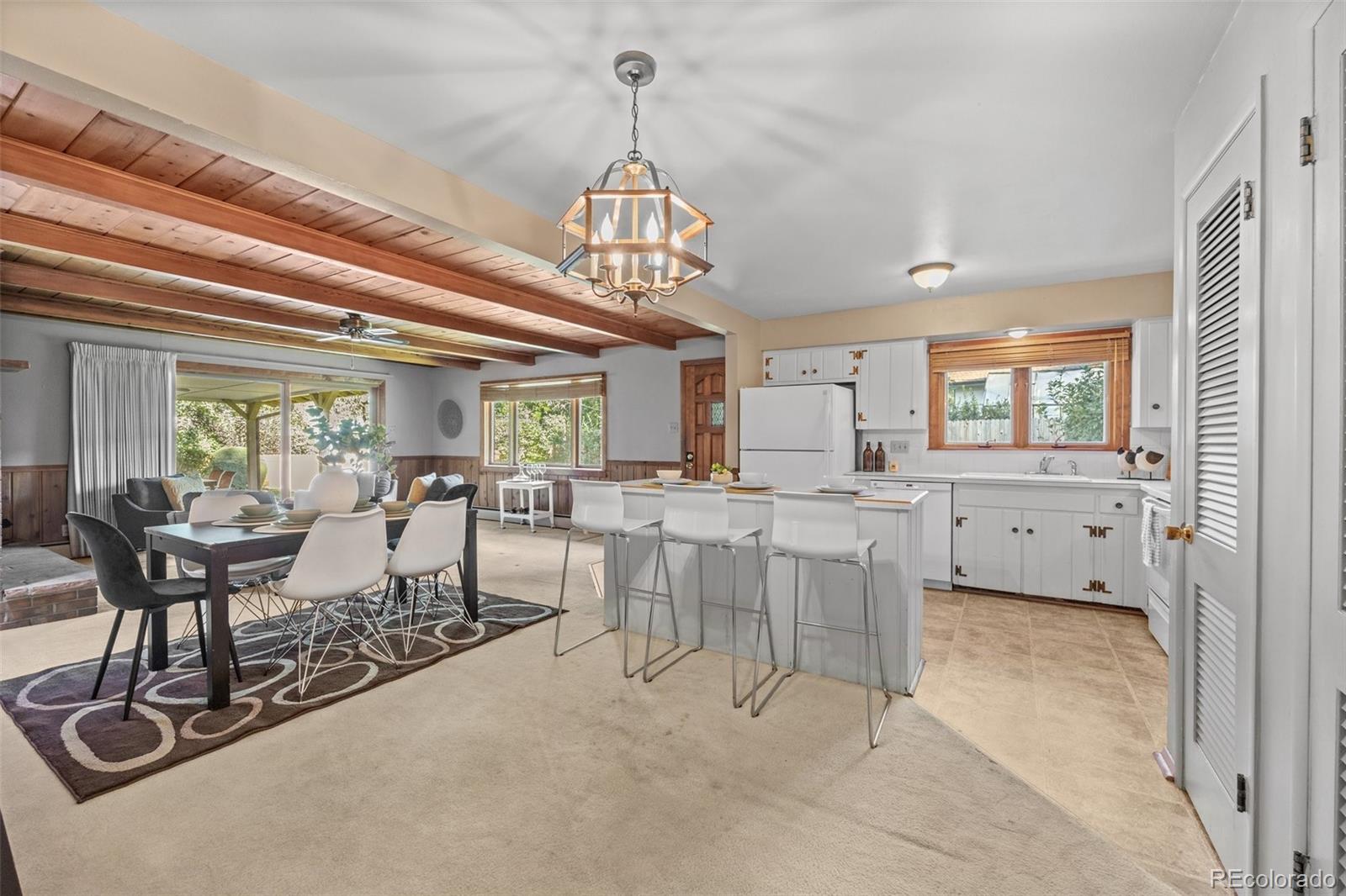 13780 Crabapple Road Golden, CO 80401 - Photo 3 of 39 a view of a dining room with furniture window and outside view