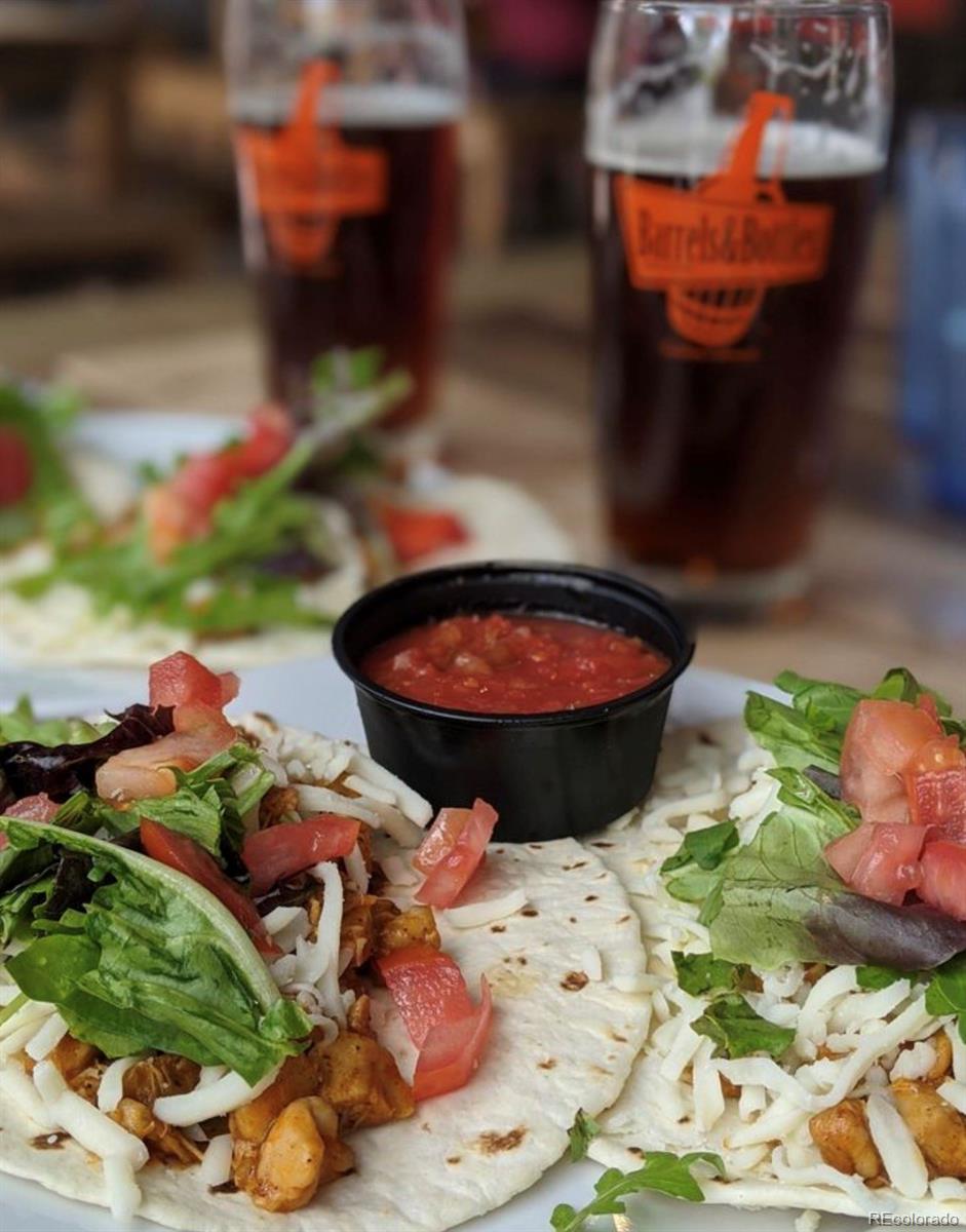 13780 Crabapple Road Golden, CO 80401 - Photo 31 of 39 a table with wine bottles sitting on it