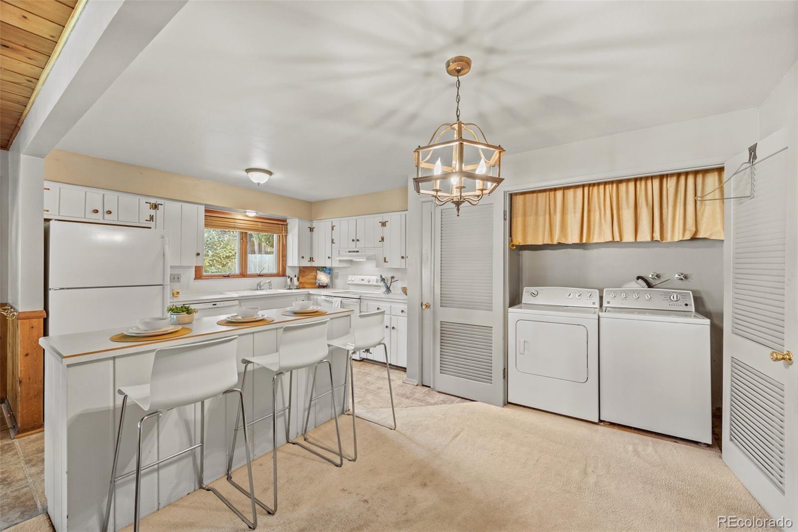 13780 Crabapple Road Golden, CO 80401 - Photo 5 of 39 a kitchen with cabinets and stainless steel appliances