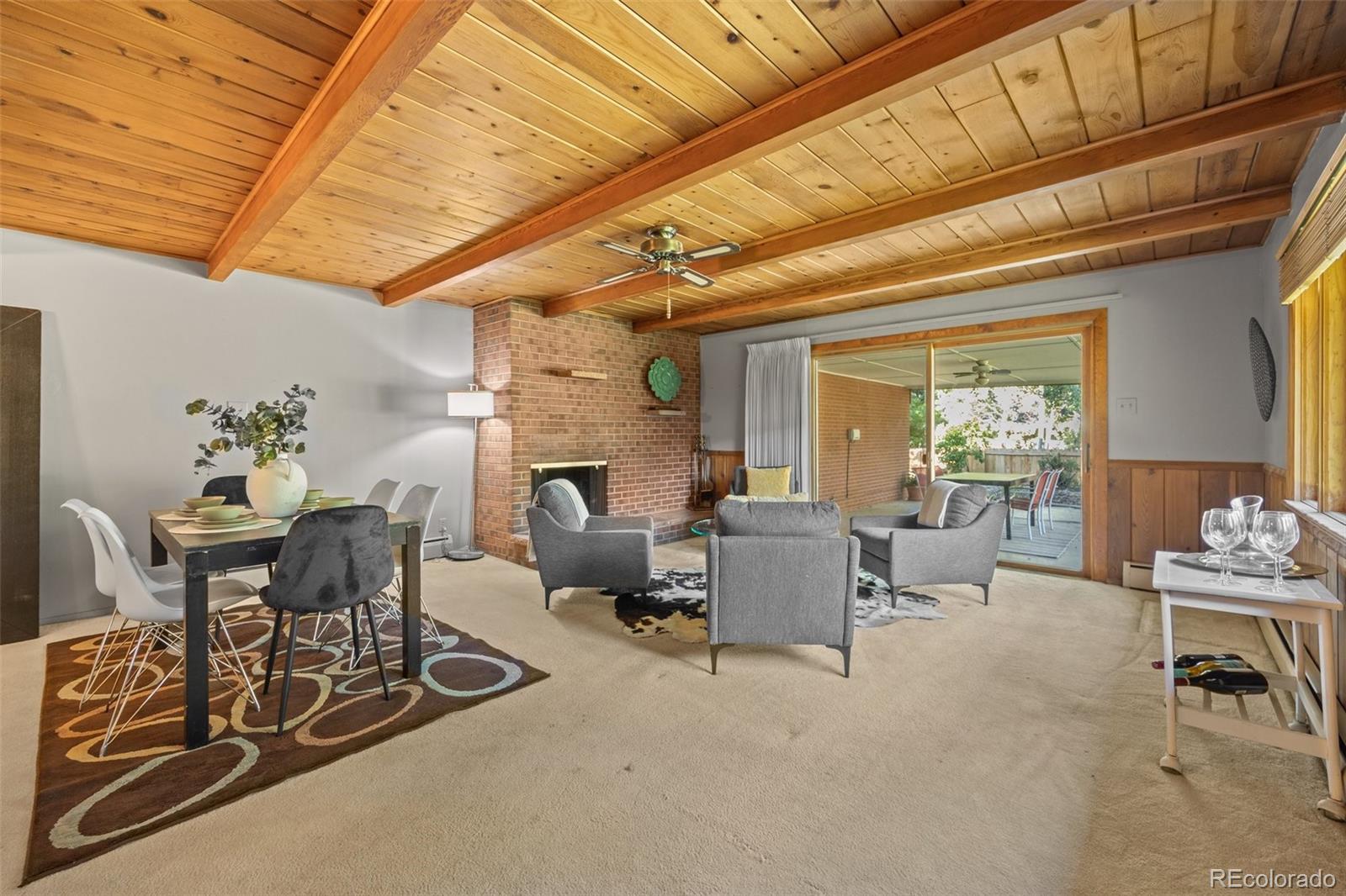 13780 Crabapple Road Golden, CO 80401 - Photo 7 of 39 a living room with furniture and a fireplace