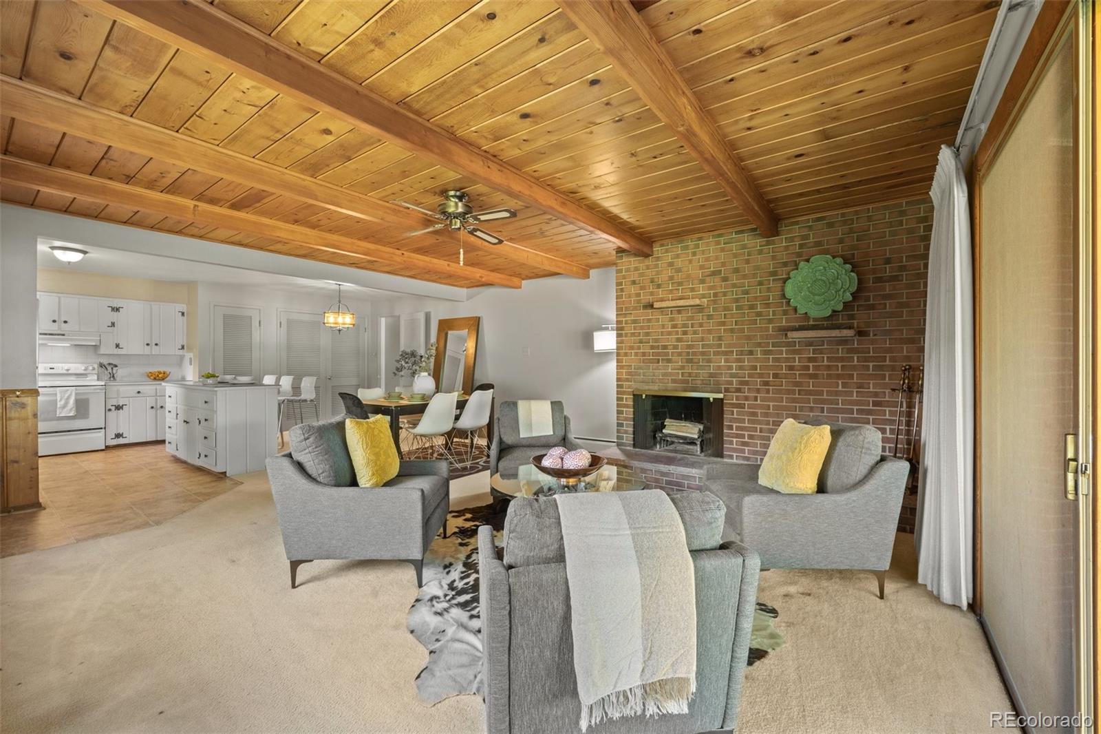 13780 Crabapple Road Golden, CO 80401 - Photo 8 of 39 a living room with furniture and a fireplace