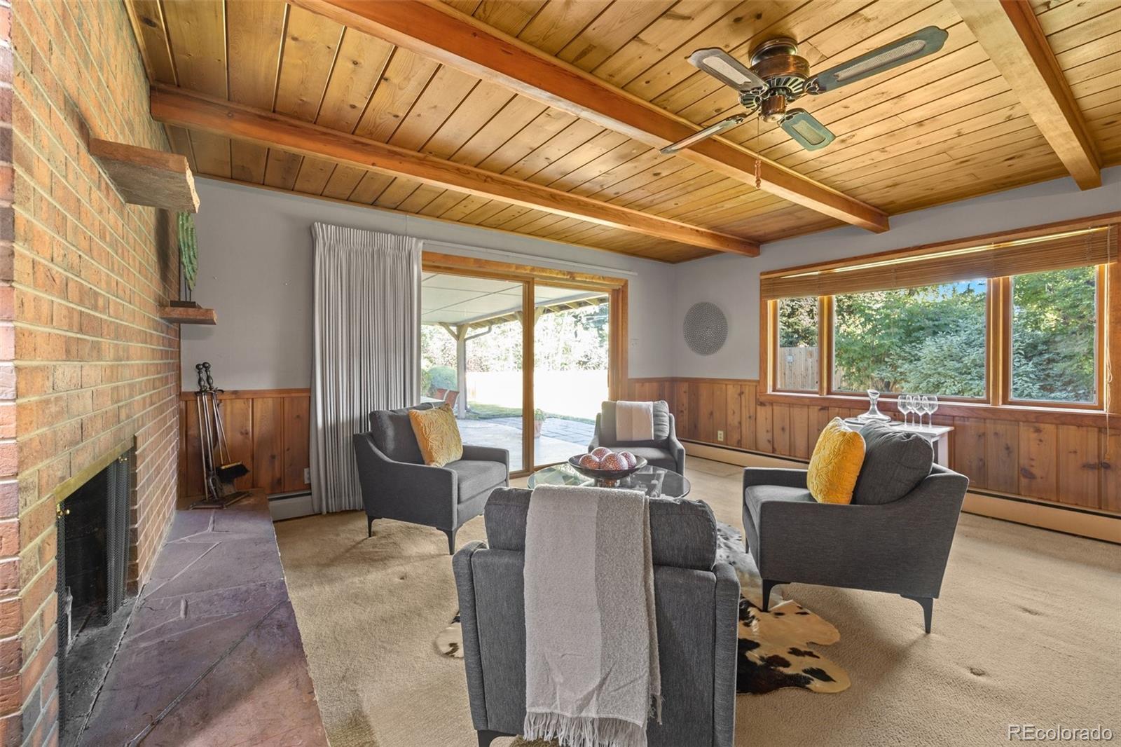 13780 Crabapple Road Golden, CO 80401 - Photo 9 of 39 a living room with furniture and a fireplace