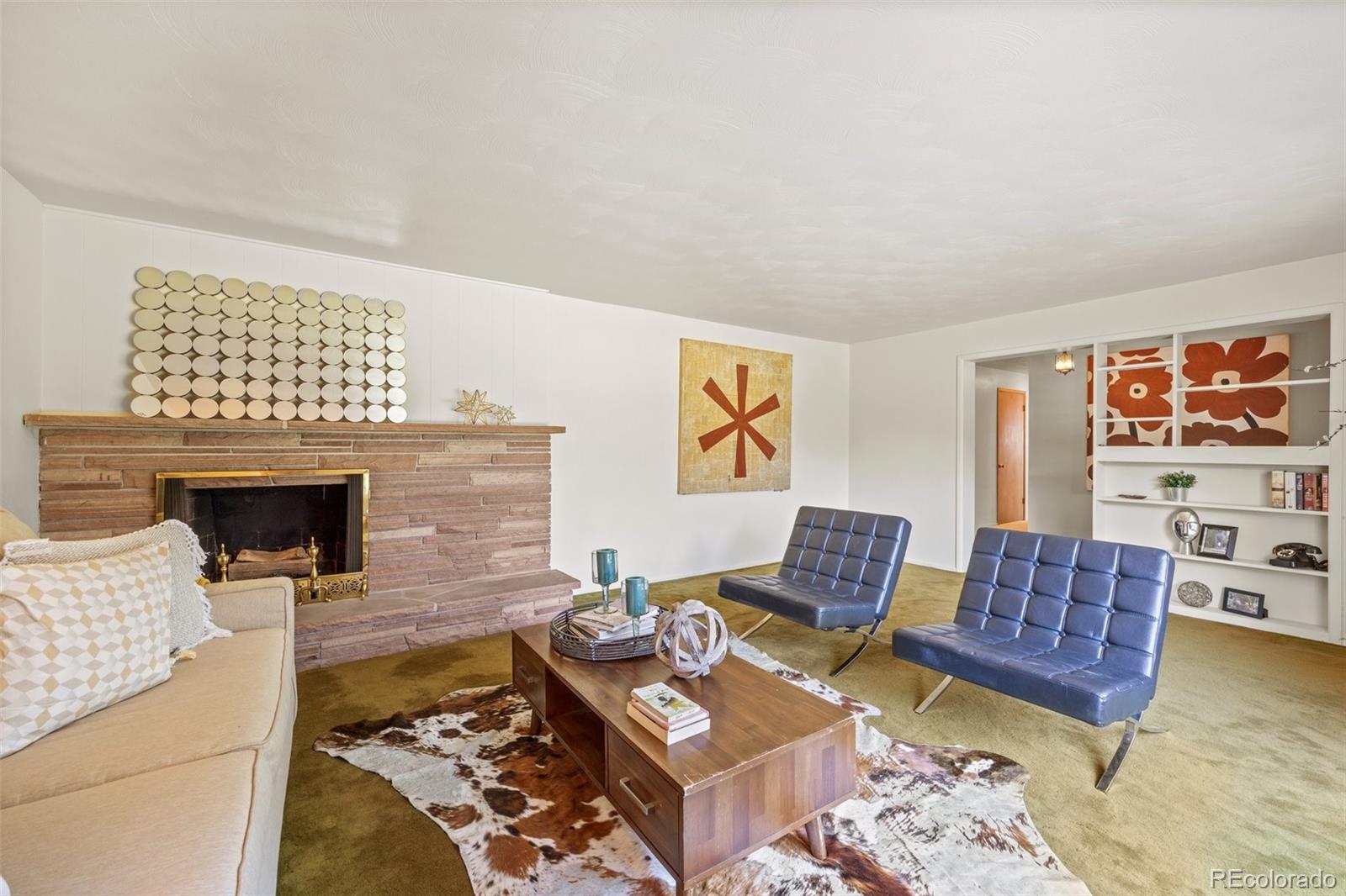 13780 Crabapple Road Golden, CO 80401 - Photo 10 of 39 a living room with furniture and a fireplace