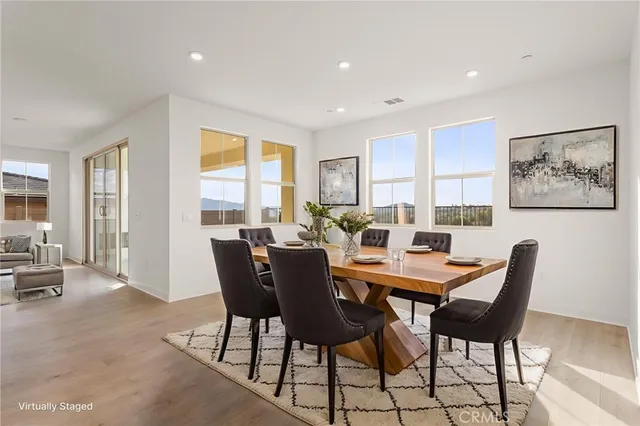 a view of a dining room with furniture window and outside view