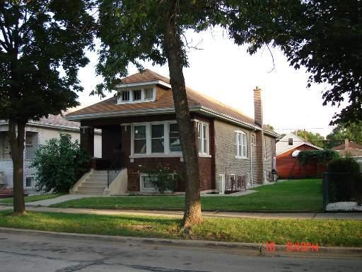 7433 West 56th Street Summit, IL 60501 - Photo 1 of 1 a front view of a house with a yard