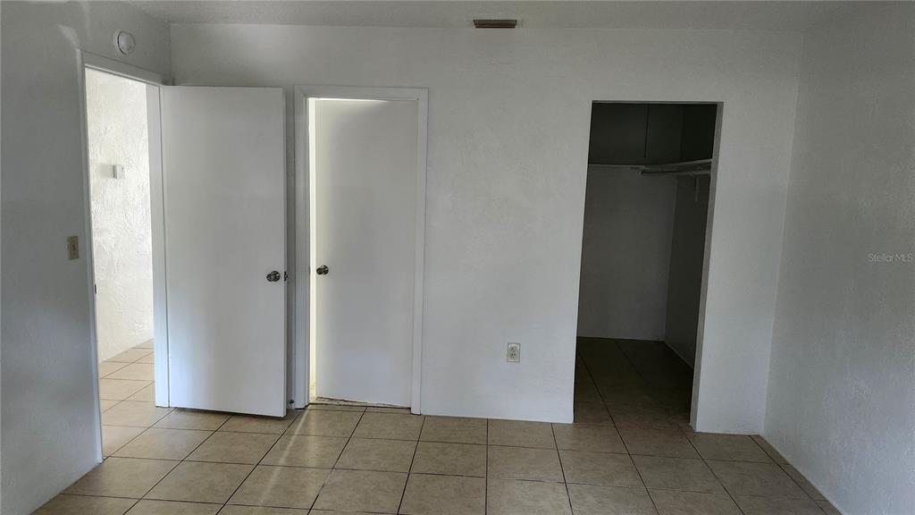 1216 Kennedy Road, Unit 10 Daytona Beach, FL 32117 - Photo 13 of 14 a view of a hallway to rooms
