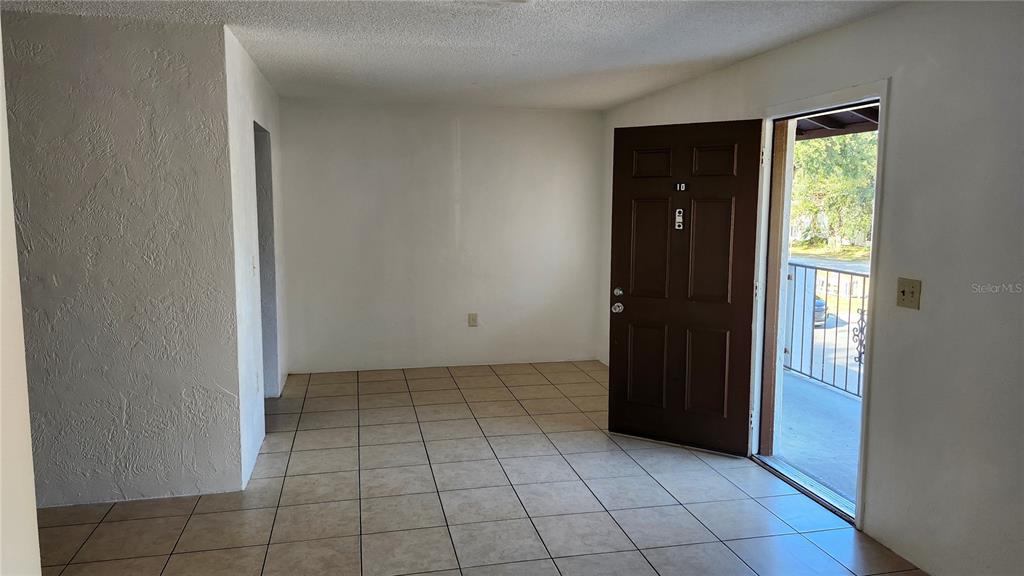 1216 Kennedy Road, Unit 10 Daytona Beach, FL 32117 - Photo 2 of 14 an empty room with closet