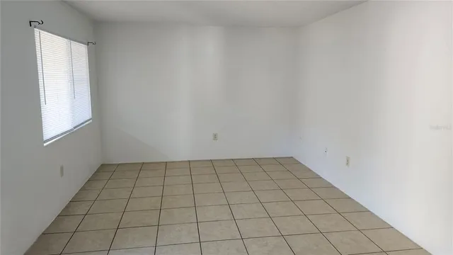 an empty room with white walls