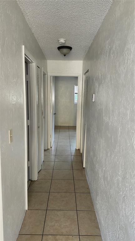 1216 Kennedy Road, Unit 10 Daytona Beach, FL 32117 - Photo 6 of 14 a bathroom with a glass door shower