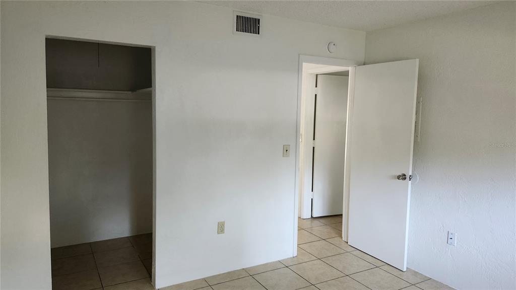 1216 Kennedy Road, Unit 10 Daytona Beach, FL 32117 - Photo 8 of 14 a view of an empty room