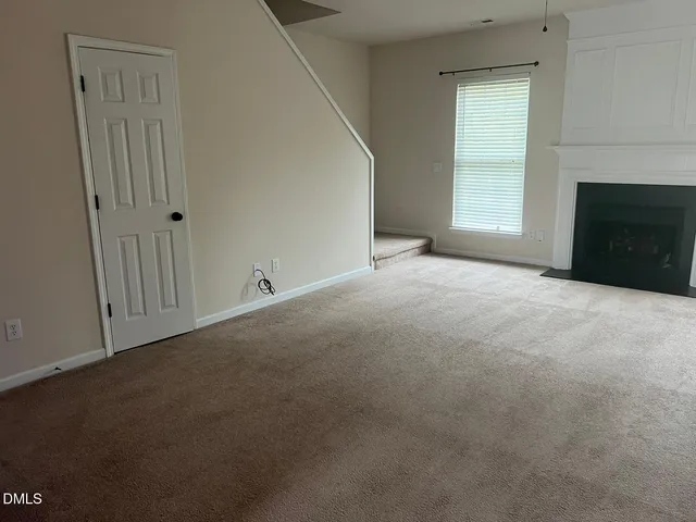 a view of an empty room and balcony