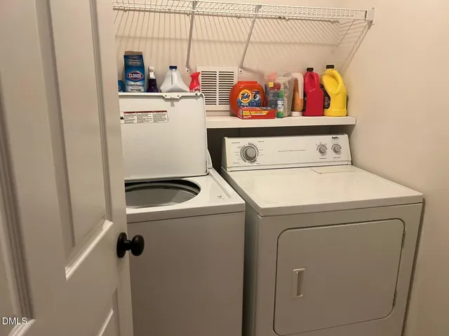 a view of a swimming pool with a table and chairs