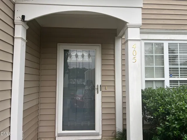 a front view of a house with a glass door
